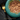 Black background with a teal bowl of Sheba sauce collection with fish in sauce pictured.