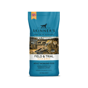A bag of Skinner's Field & Trial Duck & Rice dog food for adult working dogs, featuring a blue and white packaging design with an illustration of a rural scene.