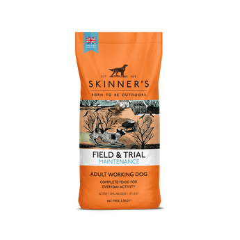 A bag of Skinner's Field & Trial Maintenance dog food for adult working dogs, featuring a orange bag with a central illustration of a lake, trees, and dogs.