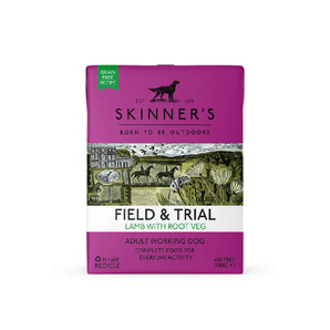 A 390g carton of Skinners Field & Trial Lamb & Root Veg wet dog food for adult working dogs, featuring a bright magenta packaging with a central rustic illustration of a farm scene.