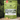 A bag of Skinner's Field & Trial dog treats sits on a log with green foliage in the background. The bag is olive green with a white and red label, and a few tan dog treats are placed in front of the package.