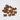 A pile of small brown bone-shaped dog treats scattered on a plain white background.