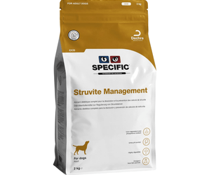 A 2 kg bag of Specific Struvite Management dog food, designed for adult dogs. The packaging features a white lower section with black and blue text, a gold logo, and a gold top seal band on a clean white background.