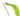 A close up of a green cat teaser toy with a caterpillar design with an embroidered smiley face and a long feathery tail on a white background.
