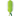 A back view of a green pea pod-shaped plush toy with a textured fabric body and a darker green ribbon tail, shown on a plain white background.