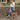 Red Labrador wearing a teal coloured Twiggy Tags Lagoon Adventure dog harness with a Close Control Lead attached. Walking on a pavement while being lead by a blonde lady, wearing glasses. 