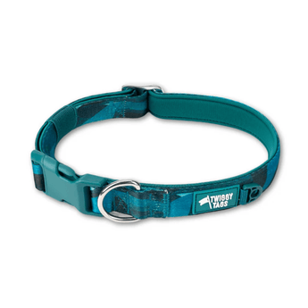 White background with a teal coloured Twiggy Tags Lagoon Adventure dog collar with a clip and d-ring with a tag with text 'Twiggy Tags'.