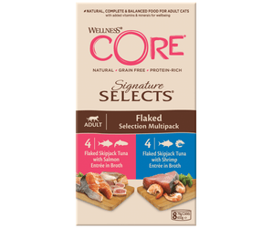 White background with a picture of a box of Wellness CORE Signature Selects wet cat food. The box is cream with text stating 'Wellness CORE, Natural, Grain Free, Protein-Rich, Signature Selects, Flaked Selection Multipack, Adult, 4x Flaked Skipjack Tuna with Salmon Entrée in Broth, 4x Flaked Skipjack Tuna with Shrimp Entrée in Broth' with a picture with a bowl of wet food below. 