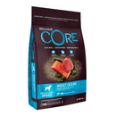 White background with a picture of a bag of Wellness CORE Ocean Dog Food. On the bag is pictures of Salmon fillet, tuna fillet and peas. The text on the bag 'Wellness CORE, Natural, Grain Free, Protein-Rich' and 'Adult, Medium/Large breed, Original, Salmon with Tuna Recipe'.