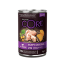 White background with a picture of a tin of Wellness CORE Original Puppy Wet Food. On the tin is pictures of chicken leg, turkey fillets and pumpkin. The text on the tin 'Wellness CORE, All breeds, Puppy Original, Chicken with Turkey with pumpkin'. 