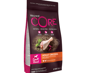 White background with a picture of a bag of Wellness CORE Original Small Dog Food. On the bag is pictures of chicken leg, peas and beets. The text on the bag 'Wellness CORE, Natural, Grain Free, Protein-Rich' and 'Small breed, Adult Original, Turkey with Chicken Recipe'. 