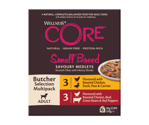 White background with a box of Wellness CORE Small Breed Dog food pictured. On the box is a bowl of wet food and text 'Wellness CORE, Natural, Grain Free, Protein-Rich, Small Breed, Savoury Medleys, Butcher Selection Mutlipack Adult.' 