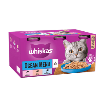 White background with a purple box of Whiskas Ocean Menu, on the box is silver tabby cat in front of a bowl on food. Text on the pack reads 'Whiskas, Ocean Menu in Jelly'.