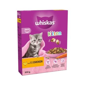 White background with a purple box of Whiskas Chicken dry kitten food, on the box is silver tabby kitten in front of a bowl on food. Text on the box reads 'Whiskas, 2-12months, with delicious chicken, 300g'.