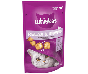 White background with a purple packet of Whiskas Relax & Unwind Treats, on the packet is silver tabby cat's face under a purple blanket. Text on the pack reads 'Whiskas Relax & Unwind, with Relaxing amino acid for calmness.' 