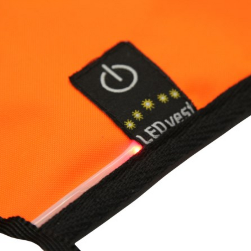 LED Safety Vest Maxi Safe Orange Extra Large zoomed in on the on button with 'LED vest' text